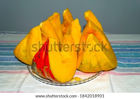 Sliced pumpkin on a plate on the table