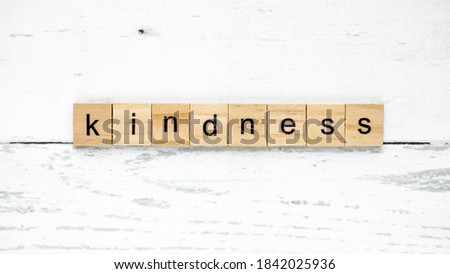 word kindness day. words from wooden cubes with letters. good heart photo