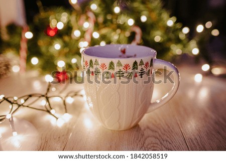 Holiday winter mug in the table 