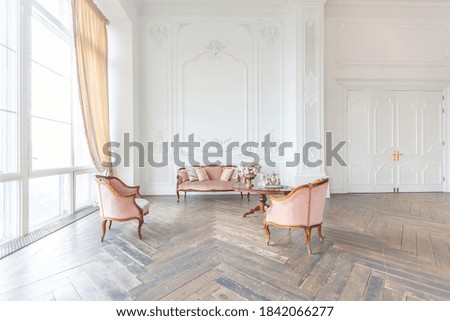 royal baroque style luxury posh interior of large room. extra white, full of day light. high ceiling and walls decorated by stucco Royalty-Free Stock Photo #1842066277