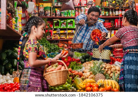 
Guatemalan grocery store, with indigenous people. Royalty-Free Stock Photo #1842106375