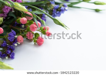 Delicate flowers on a white background with space for writing text. Fragment of a bouquet.