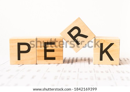 Word perk. Wooden small cubes with letters isolated on white background with copy space available.Business Concept image. Royalty-Free Stock Photo #1842169399