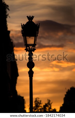 Closeup of vintage street lamp on sunset background