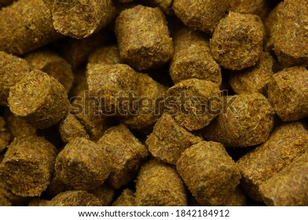Close up picture of pellets of Columbus hop dual-purpose variety