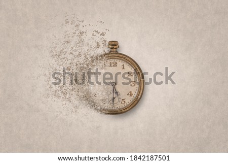 Concept of end of time or time flying. Ancient clock on a clear background disintegrates into small pieces. Royalty-Free Stock Photo #1842187501
