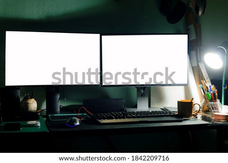 2 computer monitors on the desk at night, personal computer