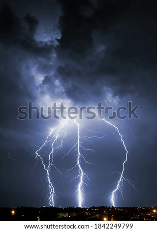 Lightening over the landscape in the summer night.
