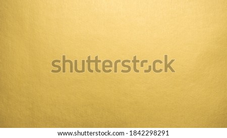 Gradation gold foil leaf shiny with sparkle yellow metallic texture background.
Abstract paper glitter golden glossy for template.
top view. Royalty-Free Stock Photo #1842298291
