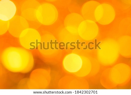 
Abstract background with lights of gold color, close-up.