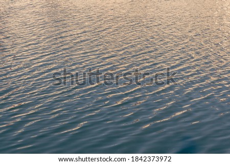 Warm and atmospheric view of the water with muted haze