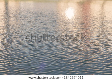 Warm and atmospheric view of the water with muted haze