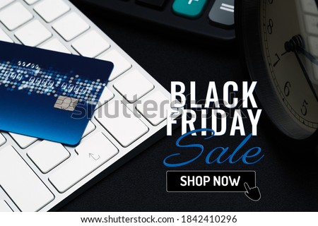 Black Friday sale concept, closeup credit card on black enter button, convenience shopping concept