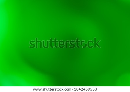 ABSTRACT SMOOTH GREEN BACKGROUND WITH GLOSSY GRADIENT