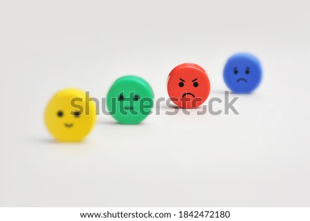 A variety of emotions: joy, serenity, anger, sadness on the colored cubes. Sudden anger in a person