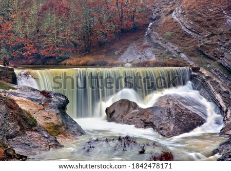 A waterfall of Pramoritsas river and a heart-shaped rock at Chrysavgi village, Voio mountain, Kozani prefecture, Western Macedonia, Greece Royalty-Free Stock Photo #1842478171