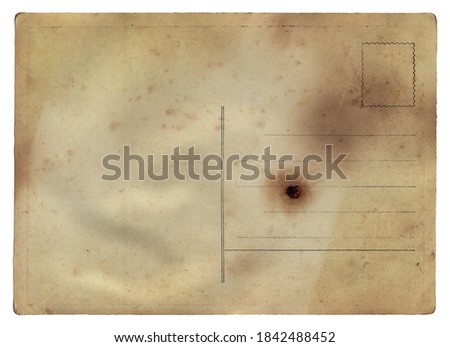 Blank old vintage postcard with burned stains isolated on white background