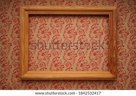 wooden frame at grunge wallpaper with clipping path