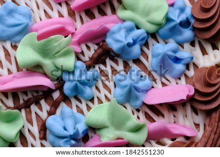 Beautiful flower decoration butter cream sweet cake with nuts close-up macro photography
