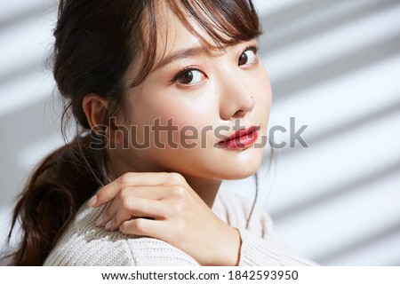 
Beauty portrait of young Asian women on light and shadow background Royalty-Free Stock Photo #1842593950