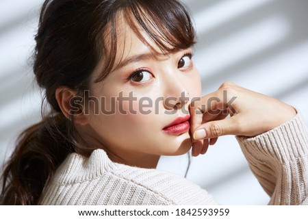 
Beauty portrait of young Asian women on light and shadow background Royalty-Free Stock Photo #1842593959