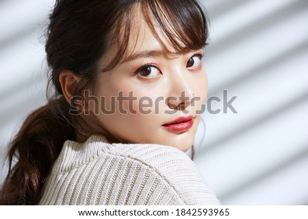 
Beauty portrait of young Asian women on light and shadow background Royalty-Free Stock Photo #1842593965