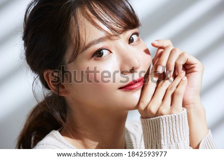 
Beauty portrait of young Asian women on light and shadow background Royalty-Free Stock Photo #1842593977