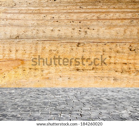 wooden fence rough background and vintage stone pavement foreground