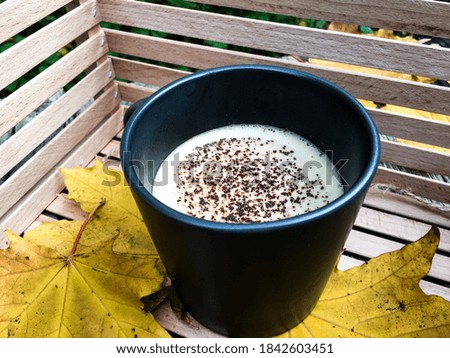 cup of coffee and autumn leaves