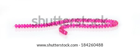 Colorful beads necklace lay on white background