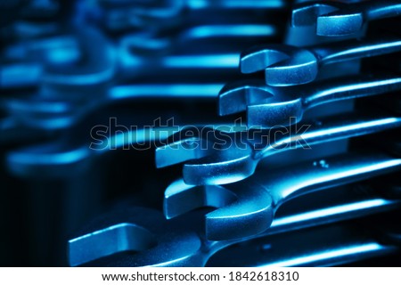 Wrenches on a black background. Tinted photo. Close-up