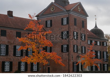 gothic facade with gate tower of Eutin castle in fall