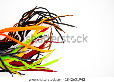 Closeup assorted shoelaces isolated on white background