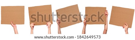 Posters of cardboard in his hands. Isolated on white. Set. Copy space.