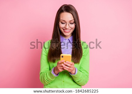 Portrait of positive cheerful girl use cellphone social network news isolated pastel color background