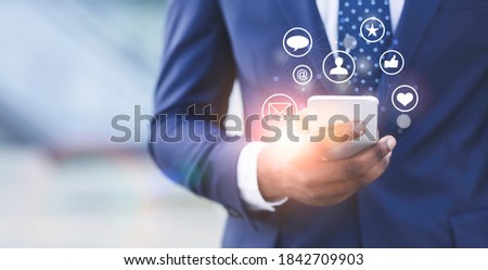 Black businessman promoting his company online, working on brand awareness in social media, collage with copy space. SMM specialist managing digital marketing campaign on smartphone Royalty-Free Stock Photo #1842709903