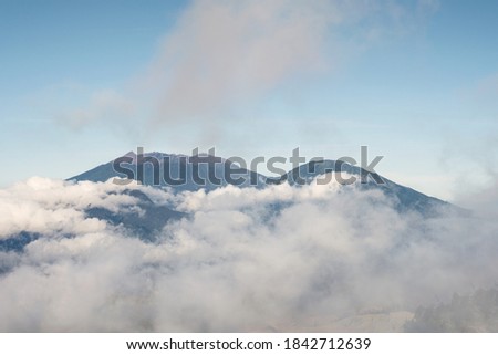 Active mount volcano in foggy and blue sky in the morning at Kawah Ijen, Indonesia