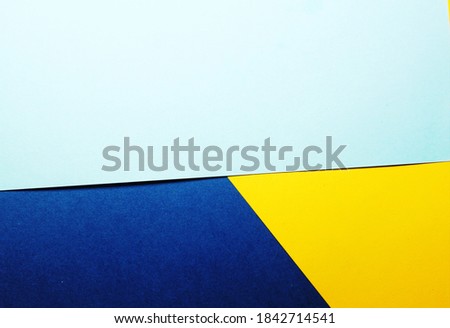 3 colour shades background (light blue, dark blue, yellow)
