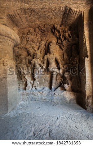 Hindu carving at Elephanta Caves, a UNESCO World Heritage Site and cave temples on Elephanta Island near Mumbai city in India Royalty-Free Stock Photo #1842731353