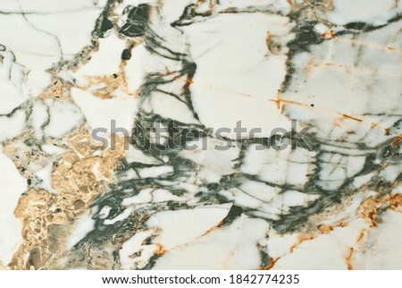 Black and white marble texture. Stone tile with natural pattern. Marble pavement closeup. A small marble crumb.