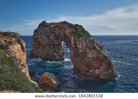 Es Pontas, a natural bridge rock on Mallorcas south coast and diving site. Royalty-Free Stock Photo #1842801538