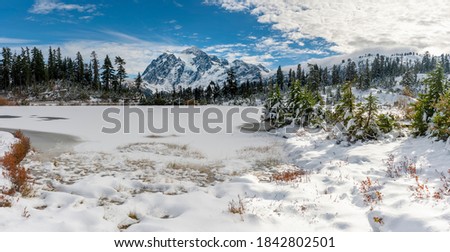 Picture Lake and Mt. Shuksan in a Winter Wonderland. One of the most photographed mountains in the world after the first snowfall of the winter season in the Pacific Northwest.