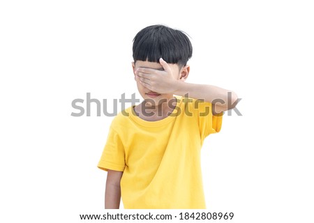 Asian little child covered his eye isolated on white background. Domestic Family violence concept. sad and unhappy child.