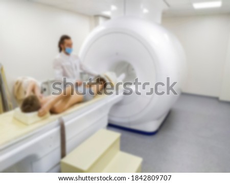 Blurred abstract background Medical computed tomography or MRI or PET in the laboratory of a modern hospital. Technologically advanced and functional medical examination of the patient.
Blur medical r