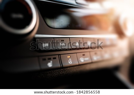Interior view of a modern new car. Climatronic or air conditioner system. Royalty-Free Stock Photo #1842856558