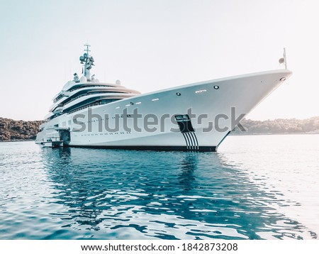 Megayacht Eclipse at anchor in front of a port Royalty-Free Stock Photo #1842873208
