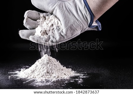 Powdered titanium dioxide is used to treat non-potable water. Functioning as a filter, preventing fouling and blocking the passage of any contaminants. Chemical material for industrial use Royalty-Free Stock Photo #1842873637