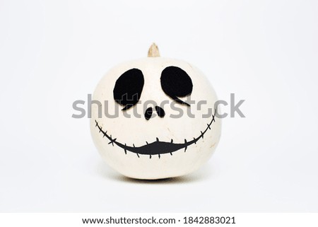 Studio portrait of white halloween smiling pumpkin, on white background.