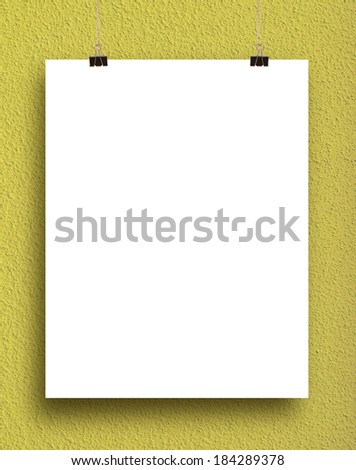 paper card on a yellow wall