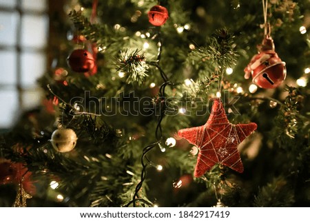 Christmas Tree decorations and lights in a house for the holidays, red, green and gold